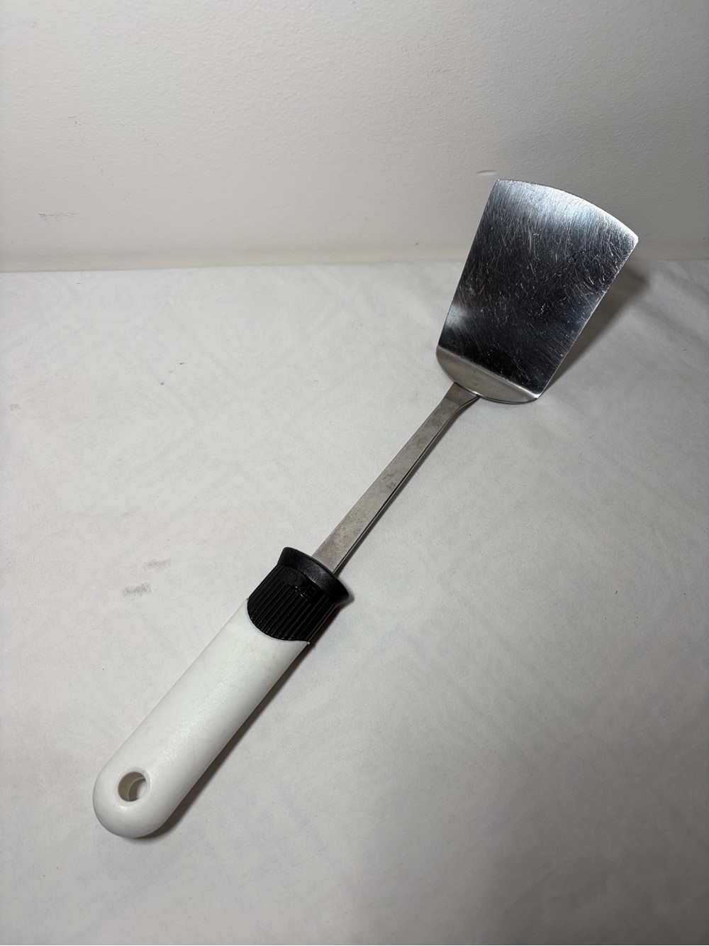 Stainless Steel Turner Spatula with White Handle and Black Grip - EKCO